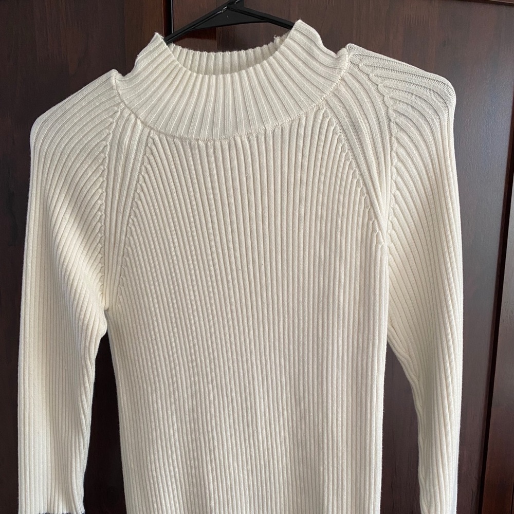 White turtle neck with fun patterned sleeves